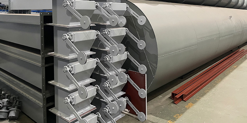 Gravity counter‑weight double flap valve for dust hopper airlock discharge