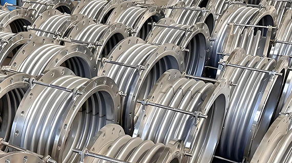 Expansion joints utilize flexible components (such as metal bellows, rubber, or fabric) to actively absorb axial/lateral/angular displacement in piping systems caused by thermal expansion, mechanical vibration, or foundation settlement.