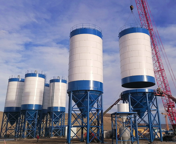 A cement silo is a steel storage container designed to hold and dispense bulk cement, fly ash, or other powdered materials used in construction and industrial applications.